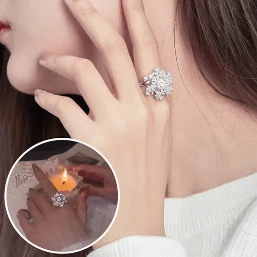 Rotating Snowflake Finger Ring — animated rotating snowflake detail on a silver band